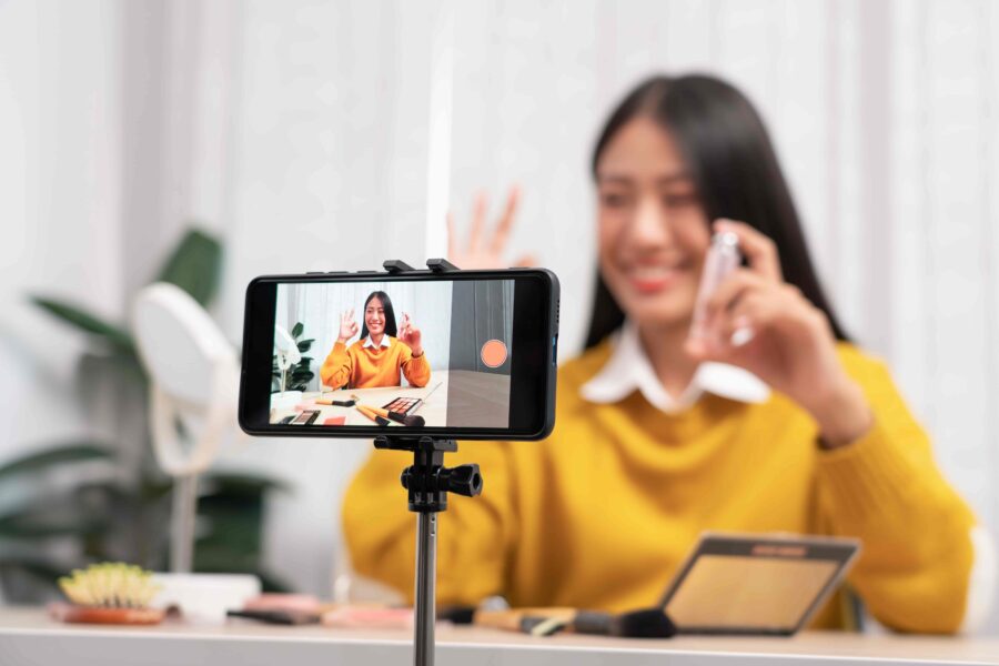 A professional person working on a side hustle in their home office at night.