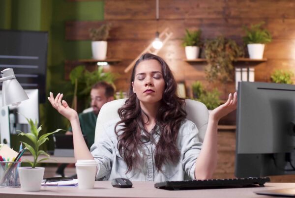 A supportive workplace meeting discussing mental health and wellbeing.