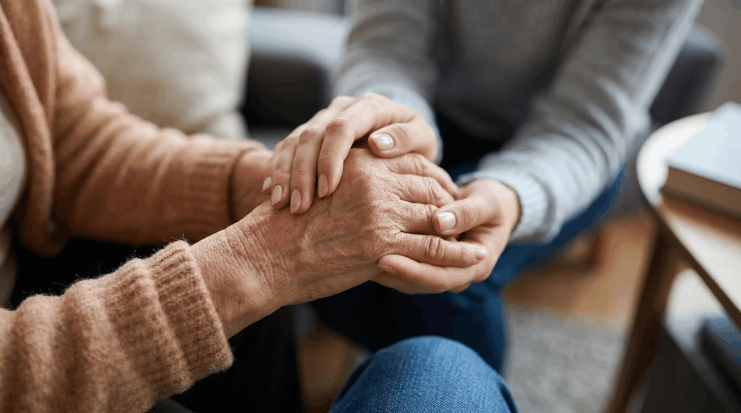 A hand held in support after a bereavement
