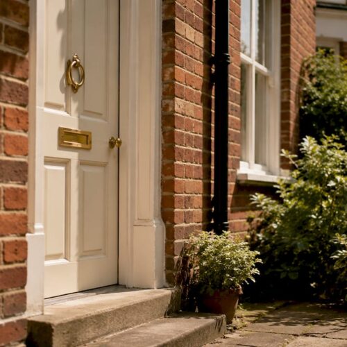 Red-brick UK house front door close-up