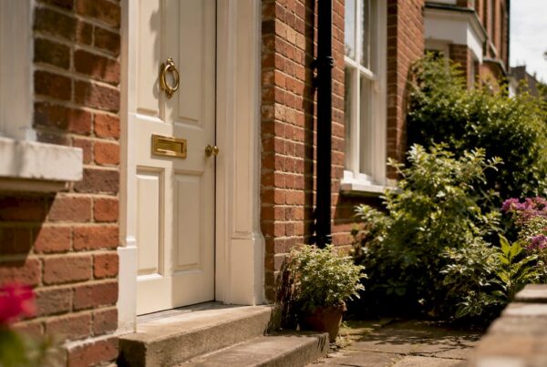 Red-brick UK house front door close-up