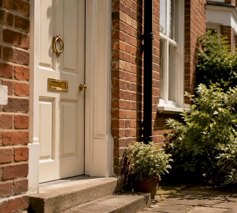 Red-brick UK house front door close-up