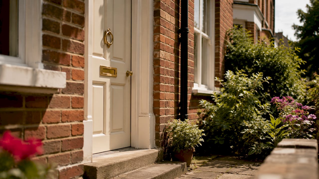 Red-brick UK house front door close-up
